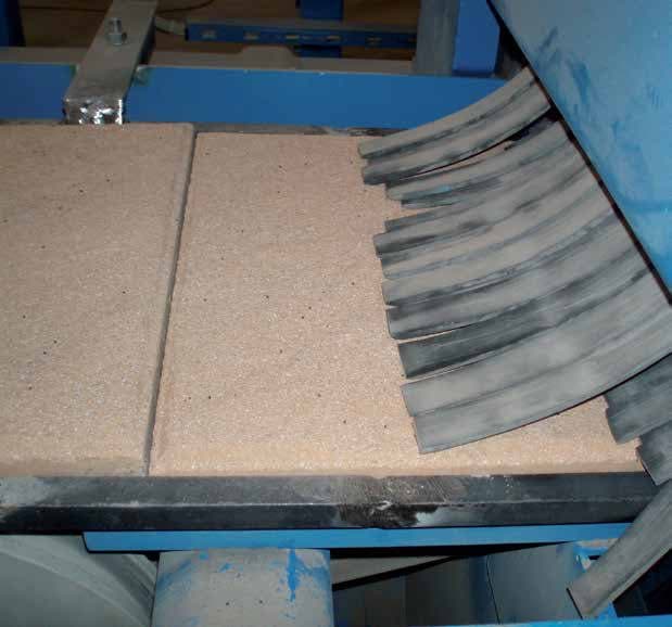 Concrete part on the belt of a blast machine